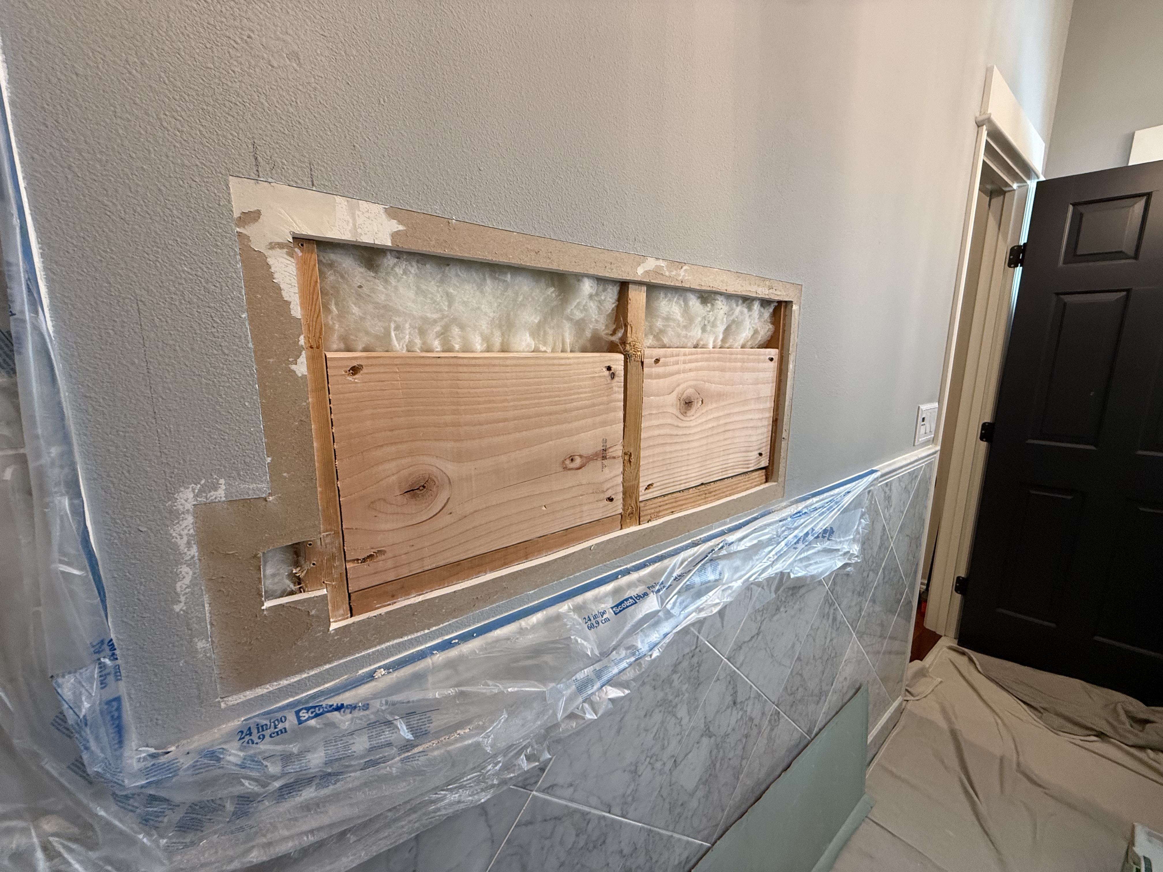 Kids towel bar kept coming loose - add blocking, ready to install it one last time! — before